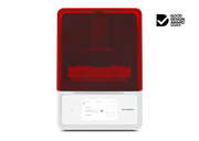 A front view of the Asiga Max 2 3D printer featuring a translucent red top hood, closed, with a filtered view of the build plate and material tray, and a white lower control panel featuring a touchscreen interface, shown on a solid white background with a Good Design Award 2024 badge in the top right corner.