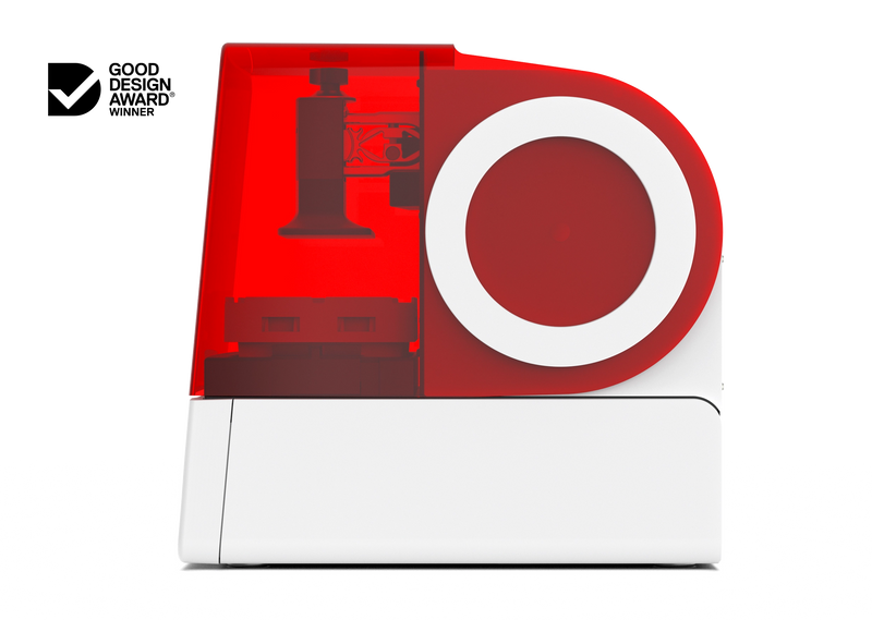 A right side view of the Asiga Max 2 3D printer featuring a fully closed translucent red top hood, showing the build plate and material tray view, shown on a solid white background with a Good Design Award 2024 badge in the top right corner.