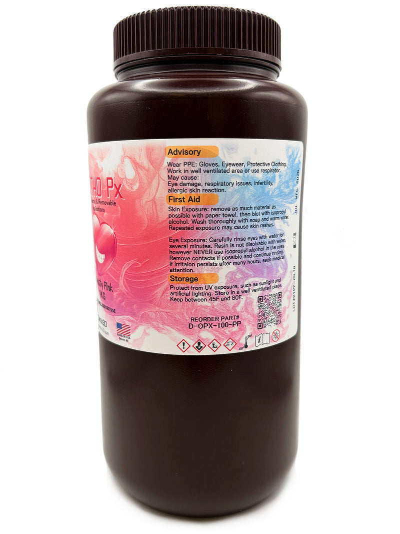 A 1KG bottle of Ortho Px Pretty Pink Orthodontic & Removable Appliances 3D Printing resin, featuring a dark brown bottle and a pink label with a heart graphic, on a white background, with general advisory, first aid and storage requirements.