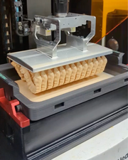 A front offset view of the Phoenix Echo resin tray with a Rapid Build Platform with GenModel Px orthodontic models being printed.