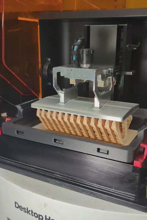 A front offset view of the Phoenix Echo resin tray with a Rapid Build Platform with GenModel Px orthodontic models being printed.